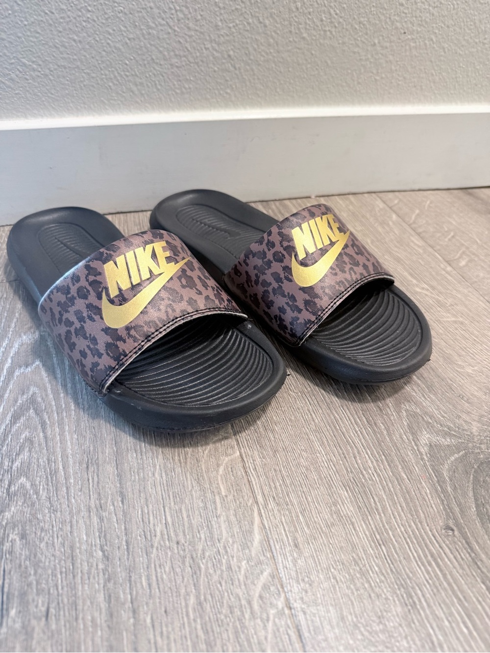 Nike Black Slides with Gold Logo and Leopard Strap